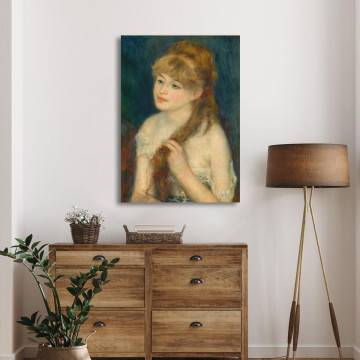 Renoir, Woman braiding her hair stretched canvas print leaning against a wall. 2