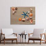 Canvas print Sea shells with sand