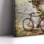 Canvas print Old street with bicycle