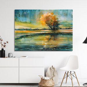 Canvas print Autumn tree reflecting in lake