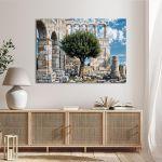 Canvas print Olive tree with ancient ruins in the background, horizontal