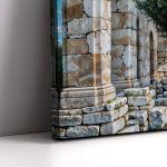 Canvas print Olive tree with ancient ruins in the background, horizontal