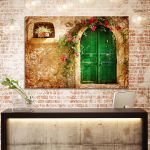Canvas print Old house with green door