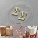 Transparent wedding stickers with gold couple initials and date for party favors and champagne color  bottles