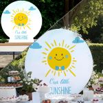 Wooden round sign with cheerful sun boy, blue bow tie. Perfect for Baptism candybar decoration in a garden.