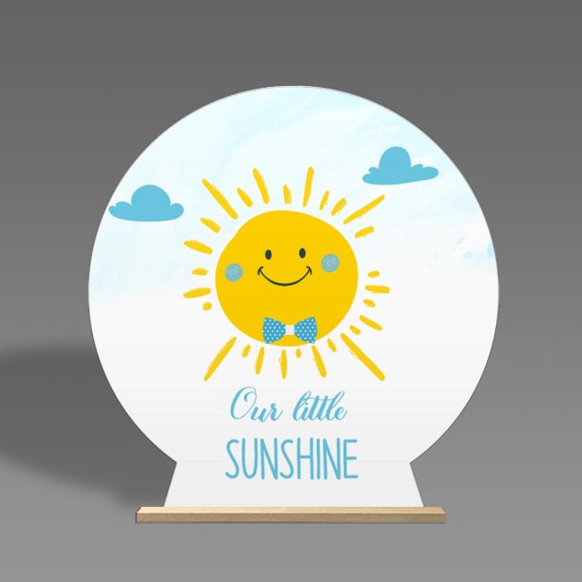 Baptism, candybar: Wooden printed sign, happy sun boy with blue bow tie. On wooden stand. 'Our little SUNSHINE'.