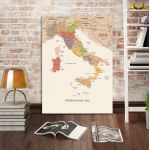 Italy map painting on canvas, colorful, leaning on a brick wall.