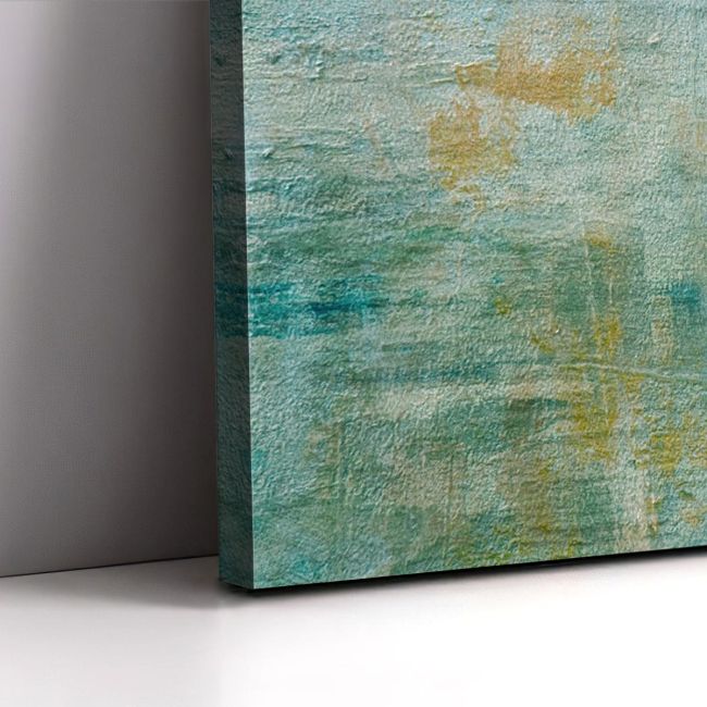 Abstract painting on canvas. Turquoise & gold brushstrokes, textured finish. Leaning against a grey wall.