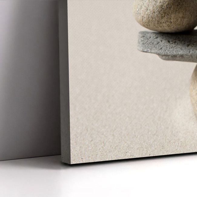 Canvas print 'Stones scale'. Minimalist composition of stacked natural stones, on wall.
