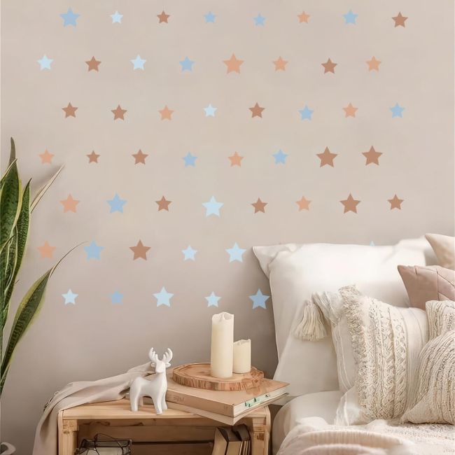 Boho brown, blue star vinyl wall stickers. Minimalist decor on a child's bedroom wall.