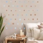 Boho brown, blue star vinyl wall stickers. Minimalist decor on a child's bedroom wall.