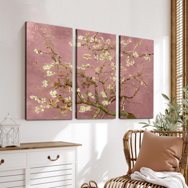 Triptych canvas print of Van Gogh's blossoming almond tree with a pink background, hanging on a living room wall.