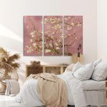 Triptych canvas print of Van Gogh's Almond Blossom with a pink background, hanging on a bedroom wall.