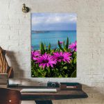 Πίνακας σε καμβά Purple wild flowers on beach