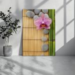 Canvas printPink orchid and gray stones
