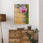 Canvas printPink orchid and gray stones