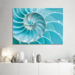 Turquoise nautilus shell spiral canvas print, marine theme, in minimalist living room above white console.