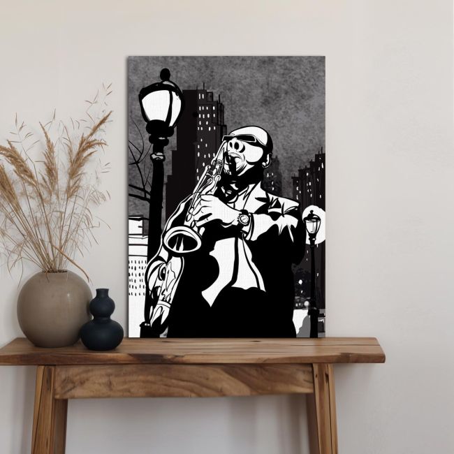 Canvas print Saxophone player in a street at night