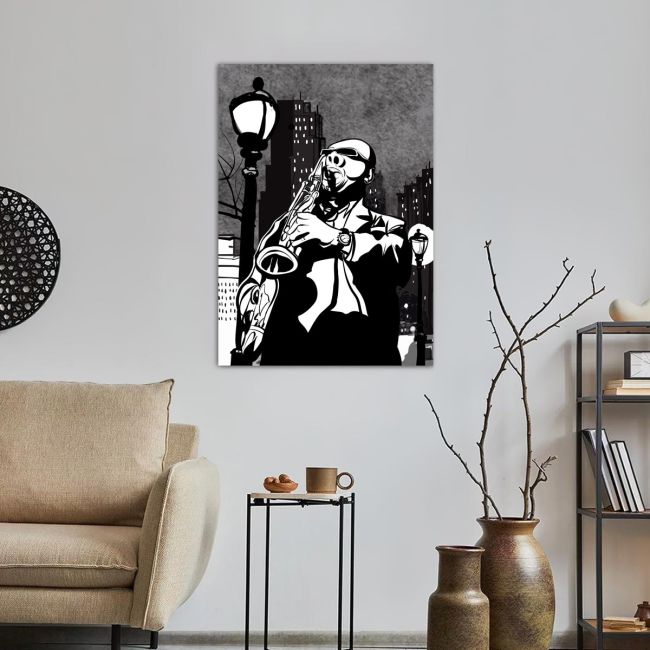 Canvas print Saxophone player in a street at night