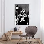 Canvas print Saxophone player in a street at night