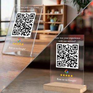 Clear plexiglass Google review QR sign. Two styles: standalone on desk, or with wood base. Minimalist, direct CTA.
