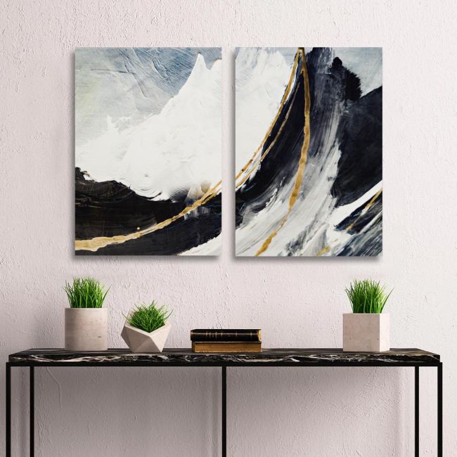 Diptych canvas print with abstract mountains and gold lines above a console table.