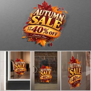 Autumn sale window sticker with gold letters and red leaves on a grey background