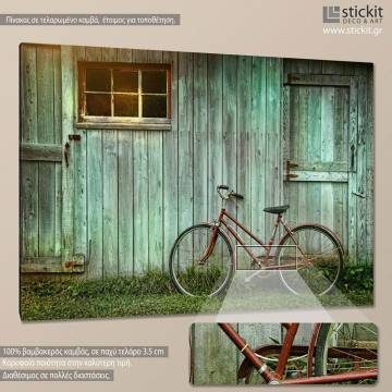 Canvas print Old bicycle leaning against grungy barn