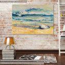 Canvas print Sea shell on a beach with sea in background