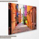 Canvas print  Colorful street in Burano, Italy, side