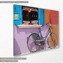Canvas print Old bike and colorfoul wall, side