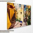 Canvas print Colorful mediterranean street in Crete, side