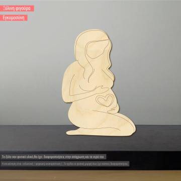 Wooden figure pregnant woman