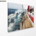 Canvas print Sail boat navigating on the waves I